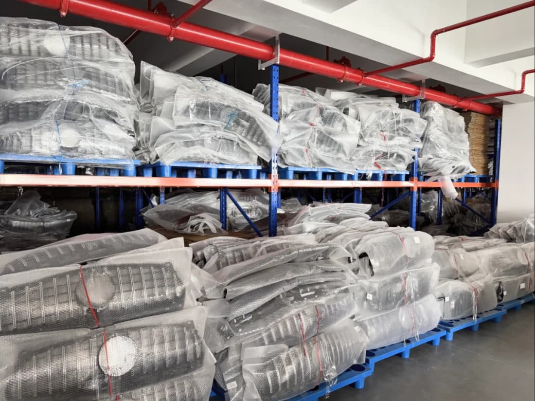 Bubble-wrapped bumpers racked and palletised in the warehouse
